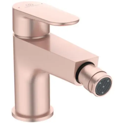 Bidetarmatur in Rosé von Ideal Standard mit einem schlichten, modernen Design und einem Push-Open-Ventil. Der Wasserhahn hat eine klare, geometrische Form.
